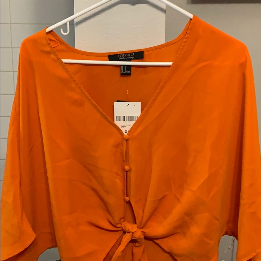 Mid sleeve lose fitting button down cropped top